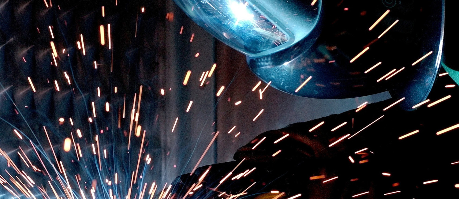 Person sparks welder